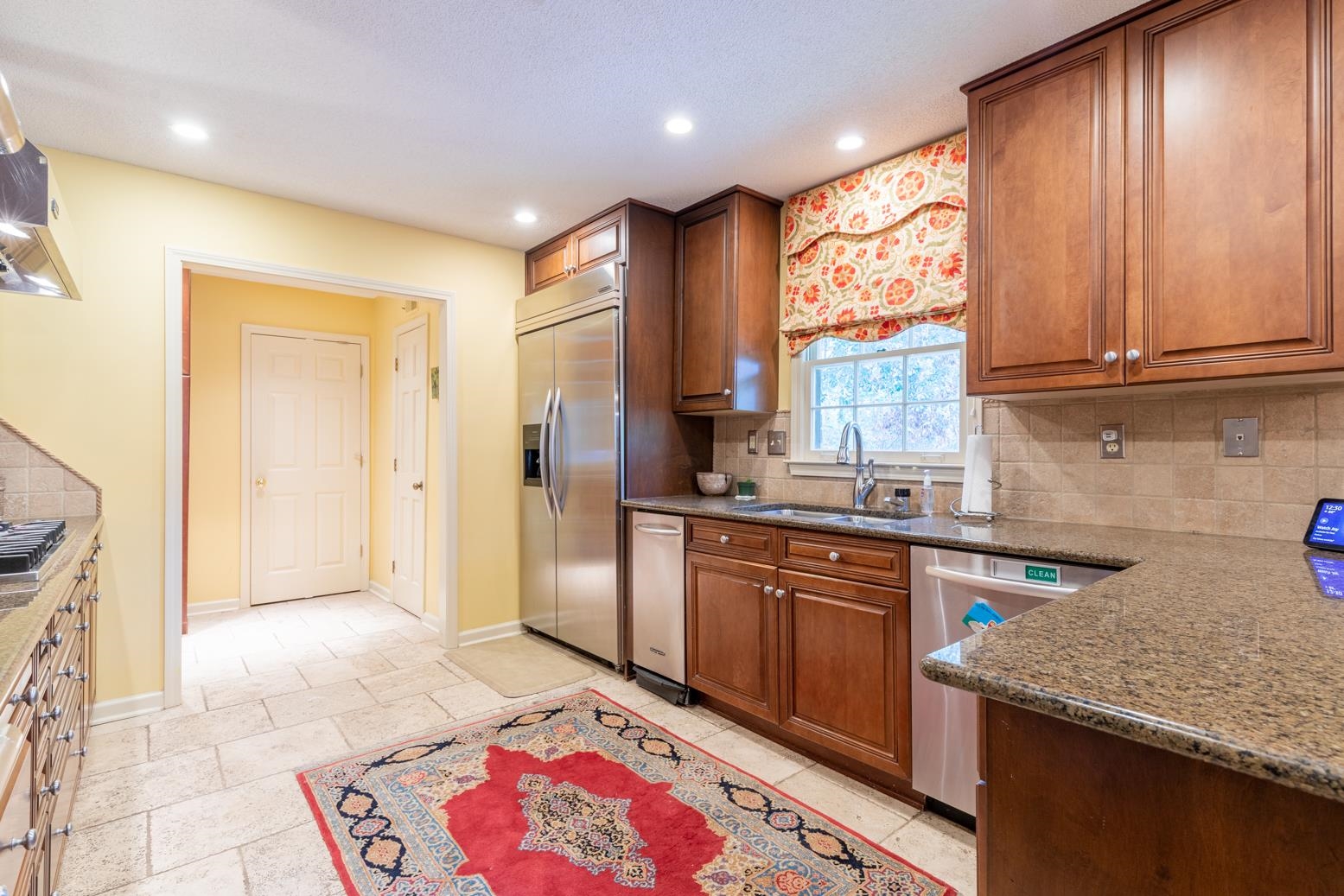 7140 River Reach Road Germantown, TN 38138 - Photo 10 of 25 a kitchen with stainless steel appliances granite countertop a refrigerator and a sink