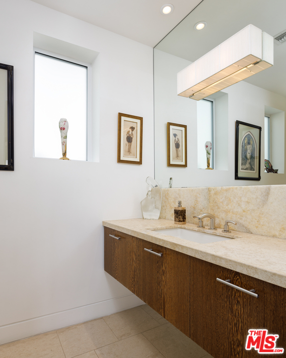 27454 Winding Way Malibu, CA 90265 - Photo 11 of 38 a bathroom with a sink and a mirror