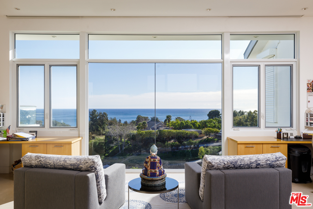 27454 Winding Way Malibu, CA 90265 - Photo 20 of 38 a living room with furniture and a large window