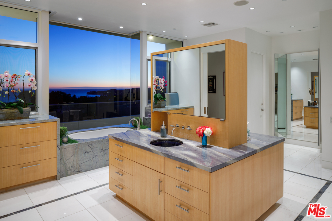 27454 Winding Way Malibu, CA 90265 - Photo 24 of 38 a kitchen with stainless steel appliances granite countertop a sink and cabinets