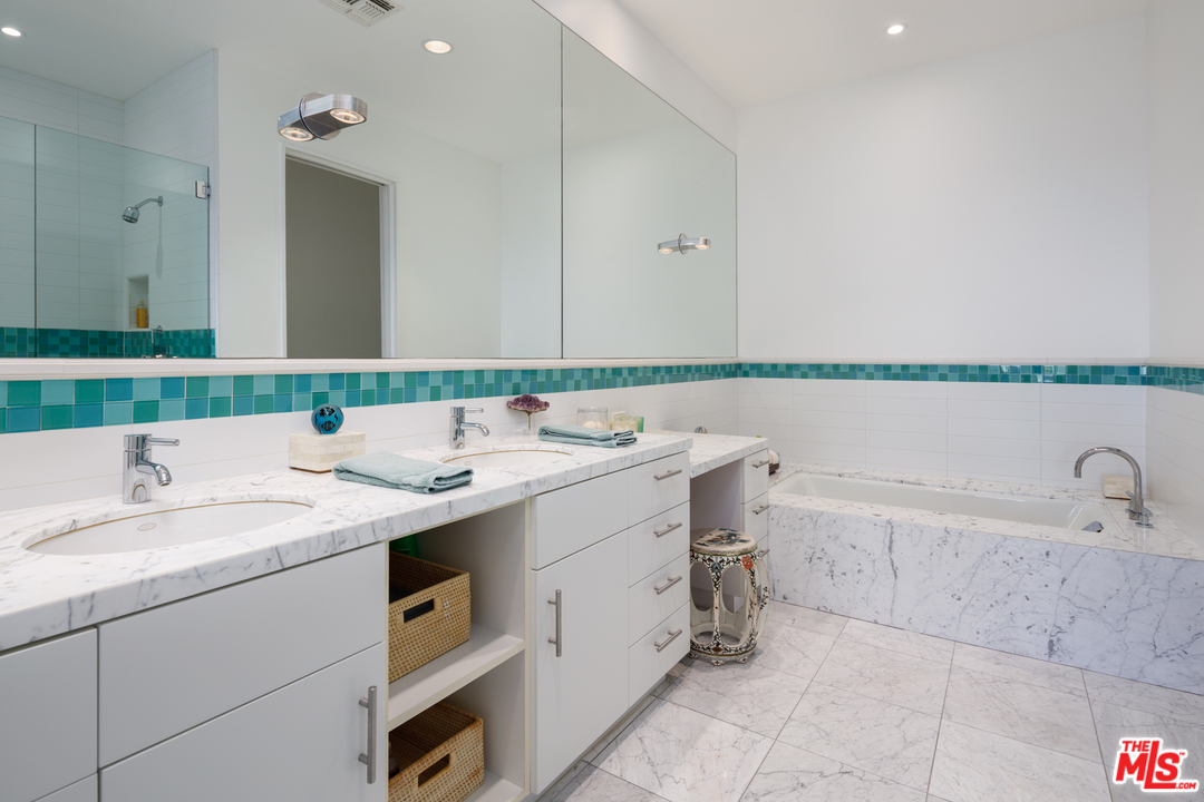 27454 Winding Way Malibu, CA 90265 - Photo 29 of 38 a bathroom with a sink and a mirror