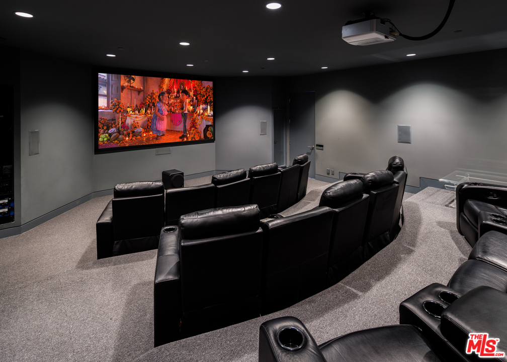 27454 Winding Way Malibu, CA 90265 - Photo 31 of 38 a room with furniture projector and screen