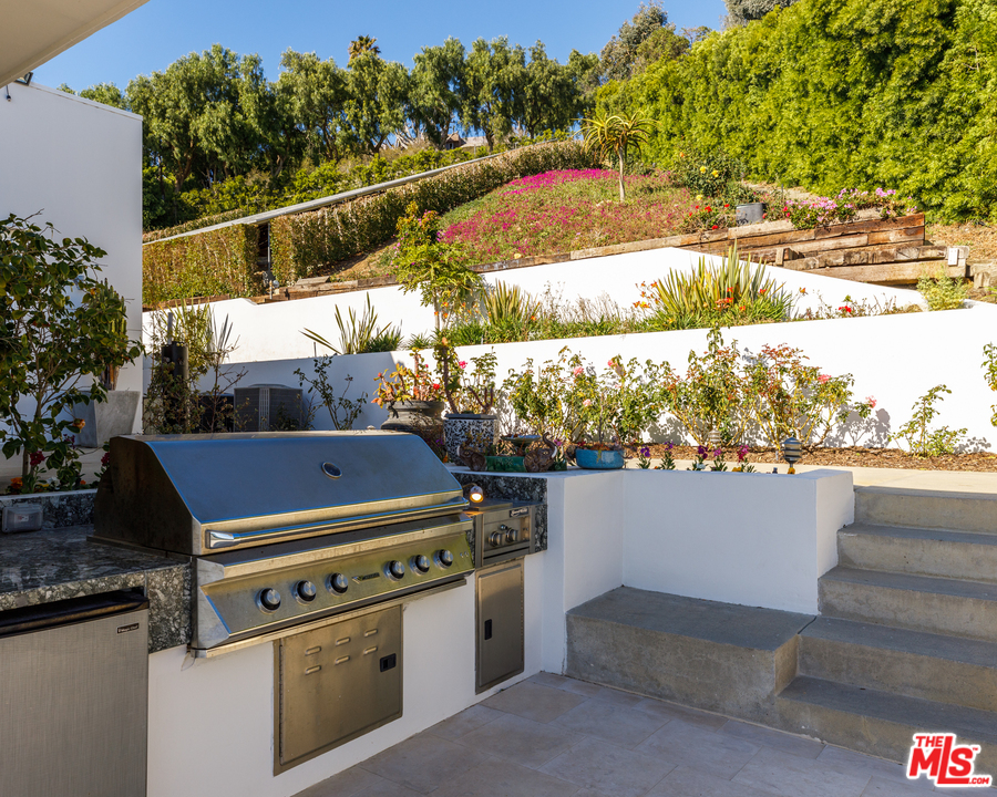 27454 Winding Way Malibu, CA 90265 - Photo 34 of 38 a view of a balcony with an outdoor space