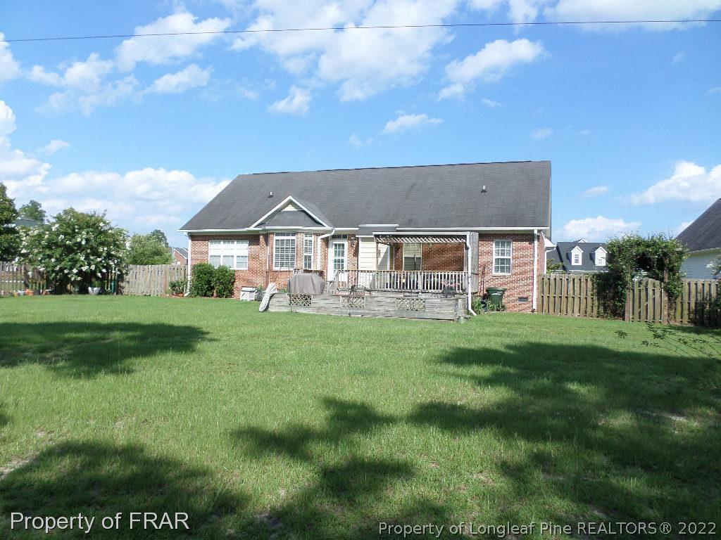 5606 Spreading Branch Road Hope Mills, NC 28348 - Photo 2 of 2 a front view of a house with a garden