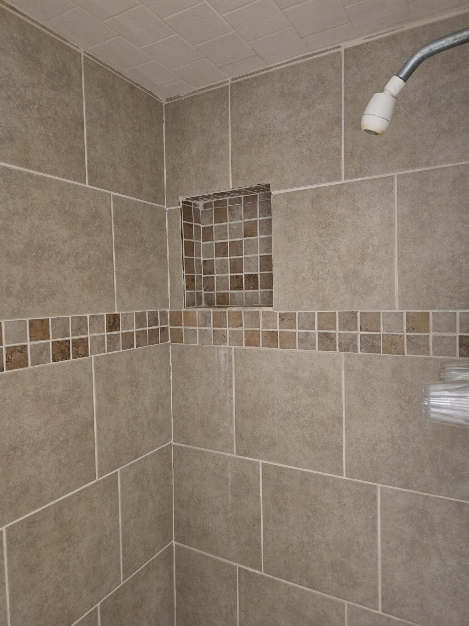 2229 South 6th Street Lamesa, TX 79331 - Photo 14 of 27 a bathroom with a shower and a sink