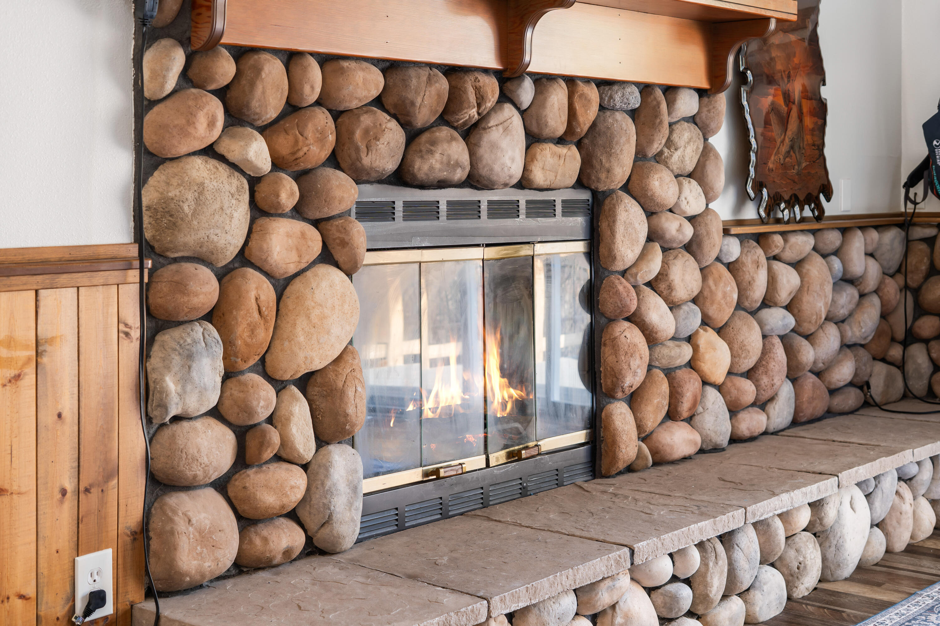 17062 Milky Way Bend, OR 97707 - Photo 18 of 39 Primary suite's private river-rock fireplace