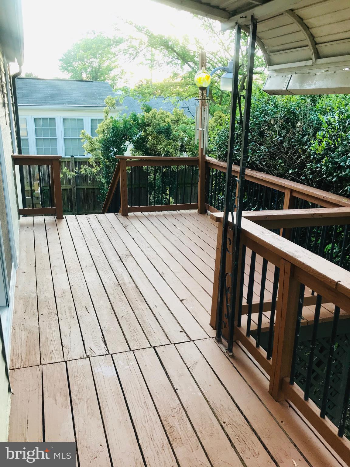 418 Cresswell Road Baltimore, MD 21225 - Photo 11 of 41 Lovely deck with fenced yard.