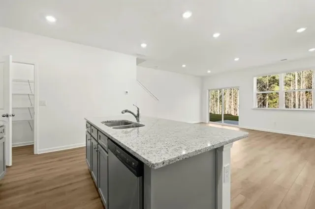 a kitchen with a sink a vanity and window