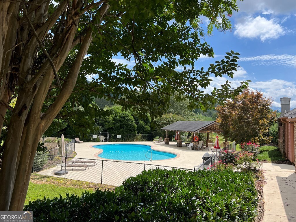 Lot 73 M Ridges Hayesville, NC 28904 - Photo 16 of 45 a view of a swimming pool with a bench and some trees