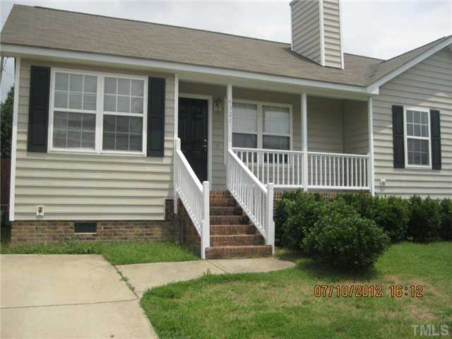 4321 Moss Spring Drive Raleigh, NC 27616 - Photo 1 of 7 a view of a house with a yard