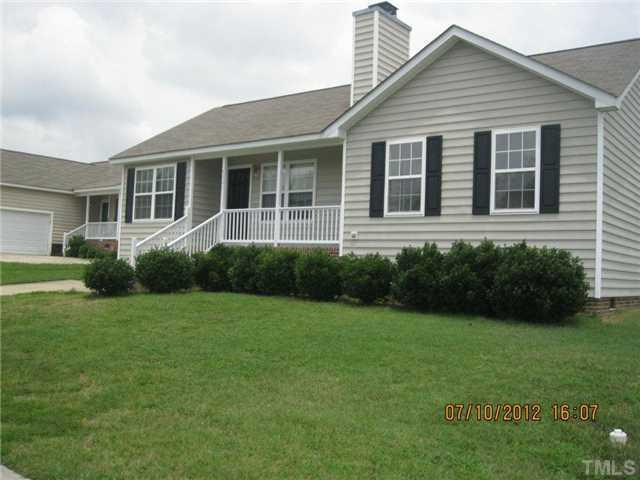 4321 Moss Spring Drive Raleigh, NC 27616 - Photo 2 of 7 a view of a house with a yard and plants