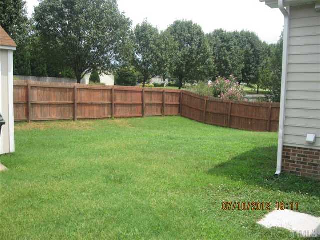 4321 Moss Spring Drive Raleigh, NC 27616 - Photo 3 of 7 a view of a backyard with white fence