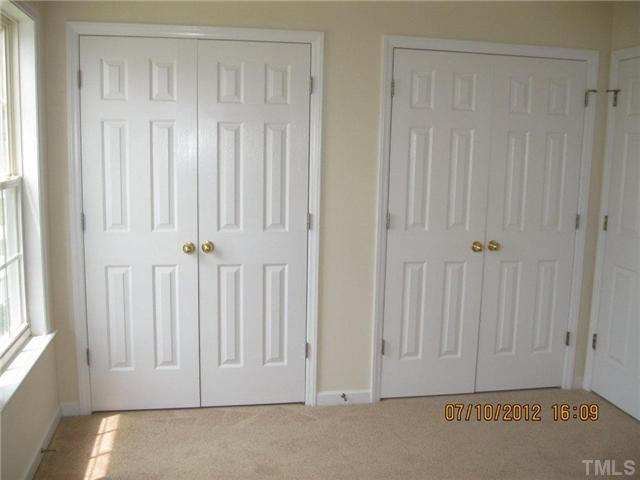 4321 Moss Spring Drive Raleigh, NC 27616 - Photo 5 of 7 a view of an entryway with wooden floor