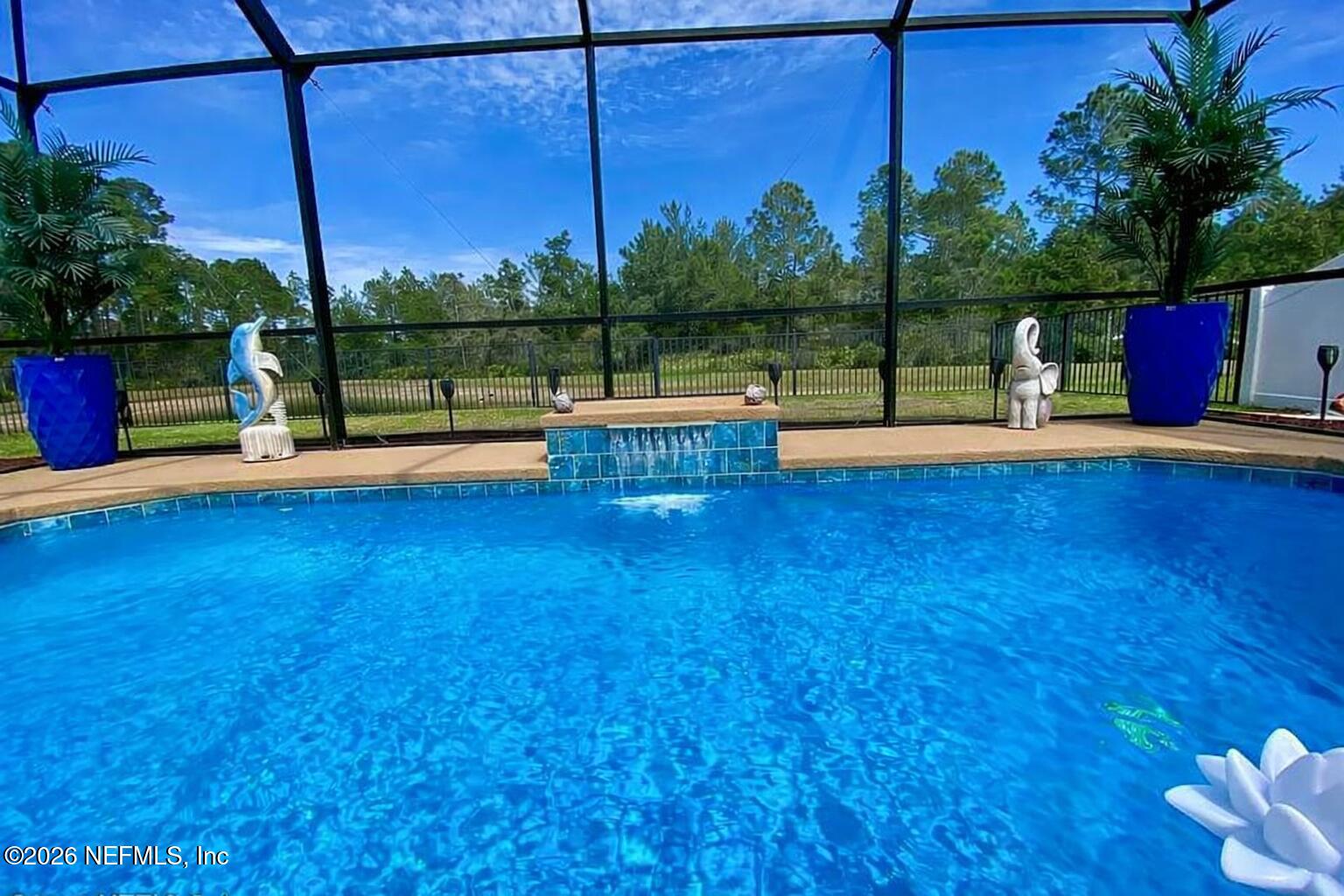 115 Sierras Loop St. Augustine, FL 32086 - Photo 47 of 65 a view of a swimming pool with a patio and a yard