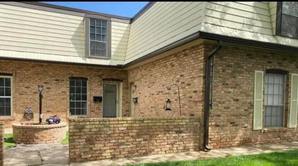 a front view of a house with an outdoor space