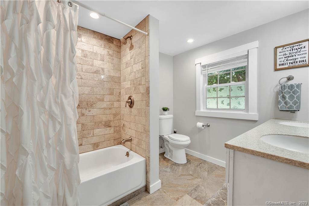 32 Lakeview Drive Bethlehem, CT 06751 - Photo 8 of 12 a bathroom with a sink a toilet and a bathtub