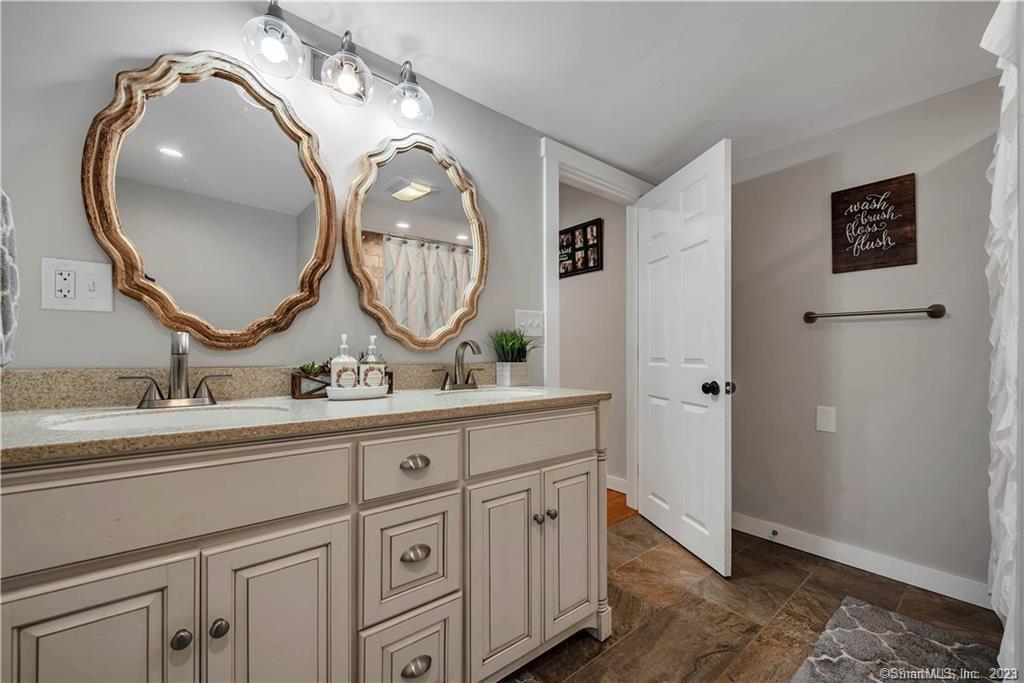 32 Lakeview Drive Bethlehem, CT 06751 - Photo 9 of 12 a bathroom with a granite countertop double vanity sink and a mirror