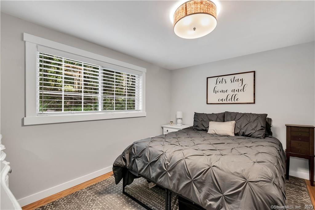 32 Lakeview Drive Bethlehem, CT 06751 - Photo 10 of 12 a bed sitting in a bedroom next to a window