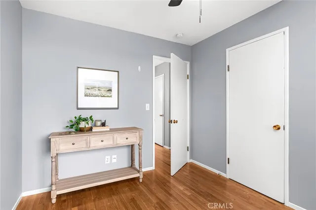 a room with a dresser and a window