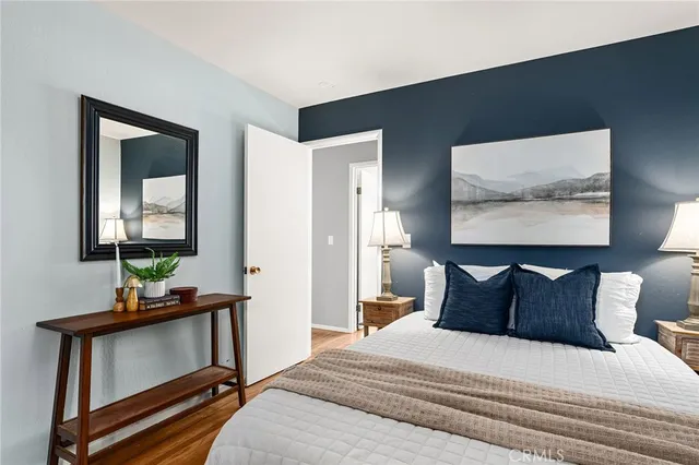 a bedroom with a bed and window