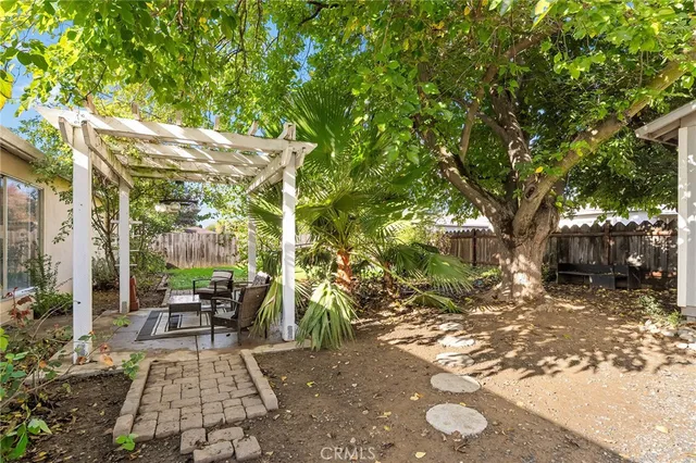 a view of yard with patio