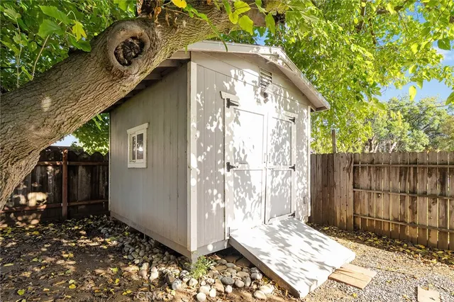 a backyard of a house with a tree