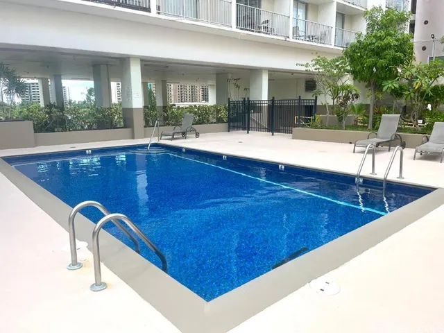 a view of a living room and kitchen