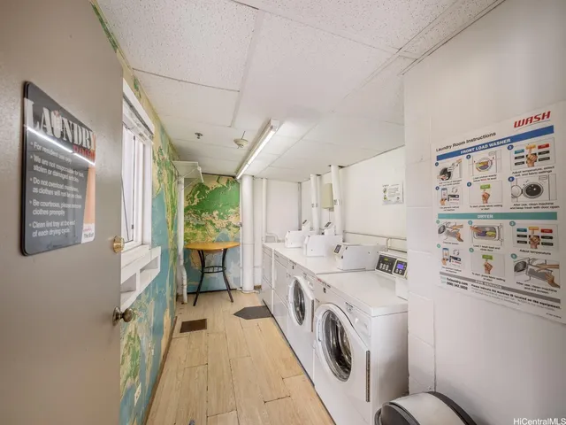 a view of a hallway with washer and dryer