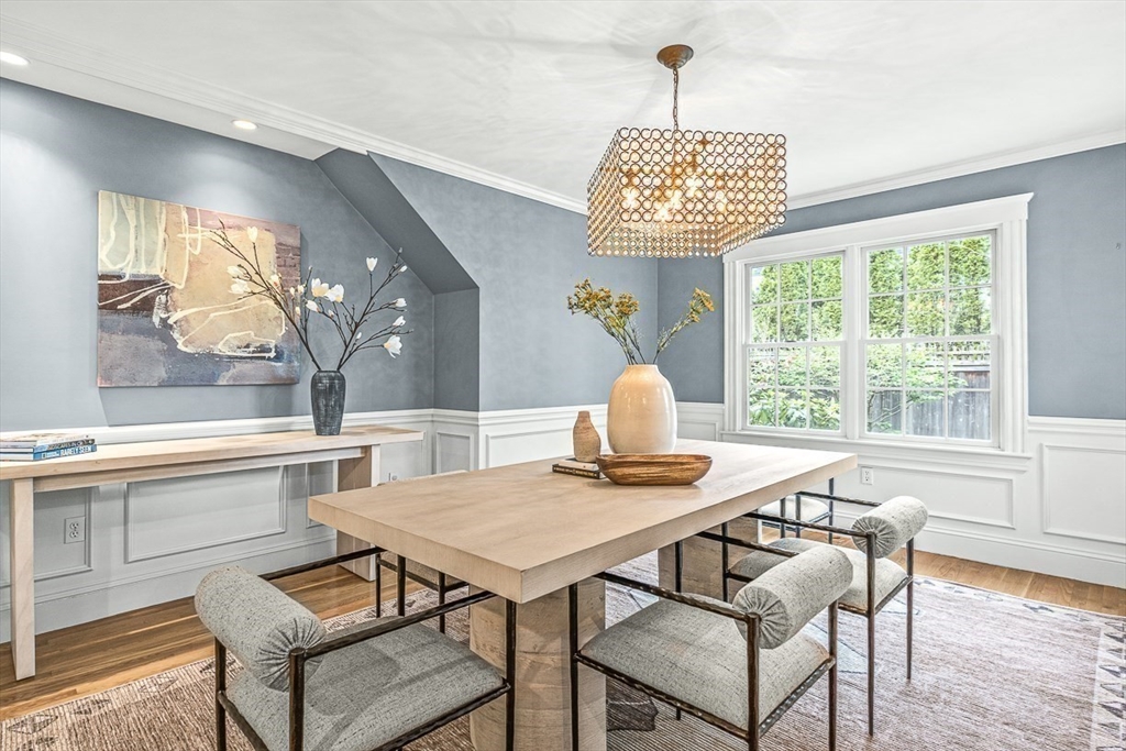 24 Birch Road Wellesley, MA 02482 - Photo 11 of 40 a view of a dining room with furniture wooden floor and a chandelier