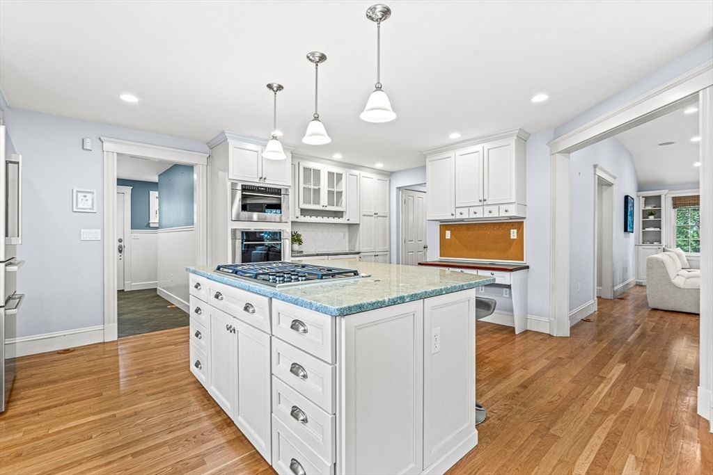 24 Birch Road Wellesley, MA 02482 - Photo 15 of 40 a kitchen with stainless steel appliances granite countertop a stove and a wooden floors