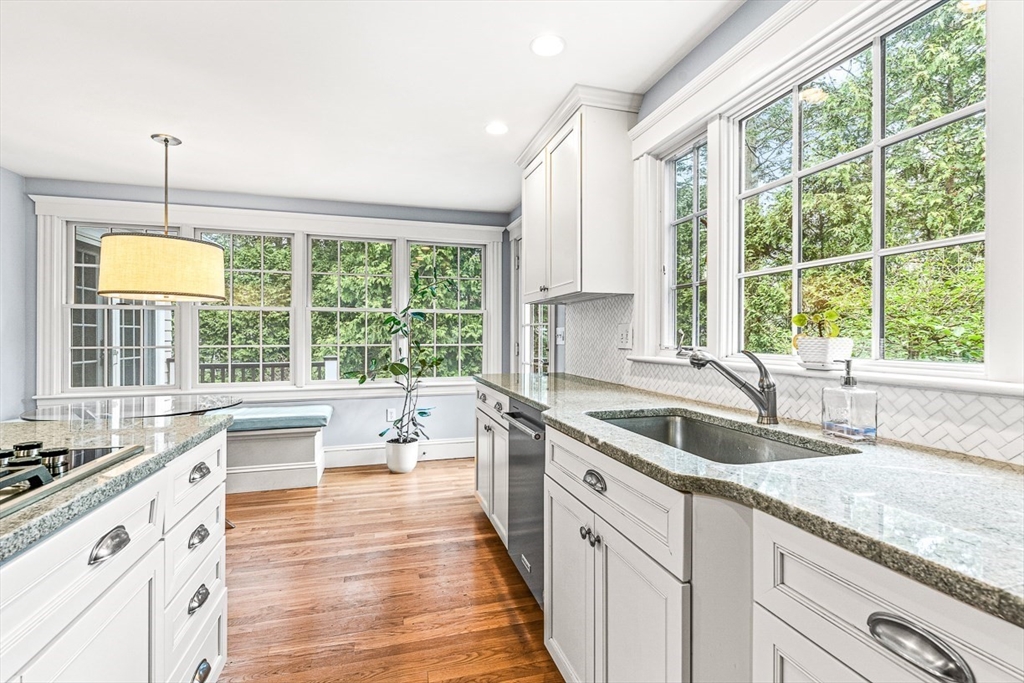 24 Birch Road Wellesley, MA 02482 - Photo 16 of 40 a kitchen with granite countertop a sink and wooden floors