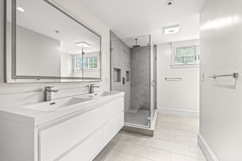 24 Birch Road Wellesley, MA 02482 - Photo 27 of 40 a bathroom with a sink and a mirror