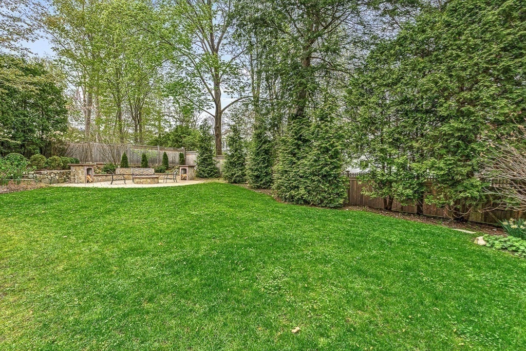 24 Birch Road Wellesley, MA 02482 - Photo 40 of 40 a swimming pool with large trees and plants