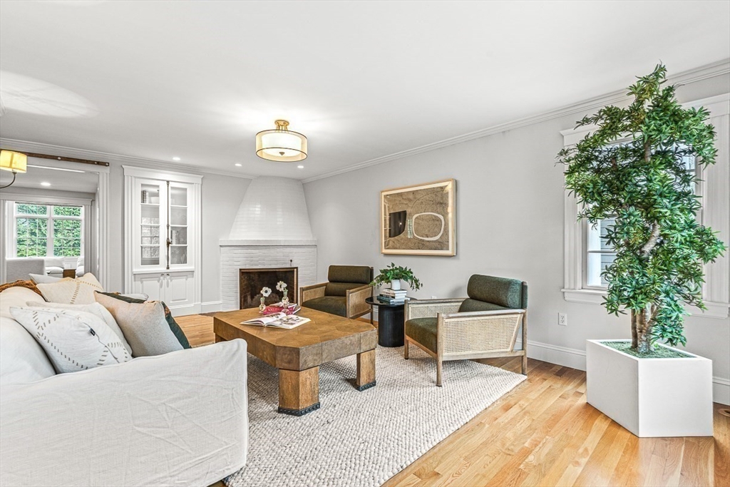 24 Birch Road Wellesley, MA 02482 - Photo 7 of 40 a living room with furniture and a fireplace