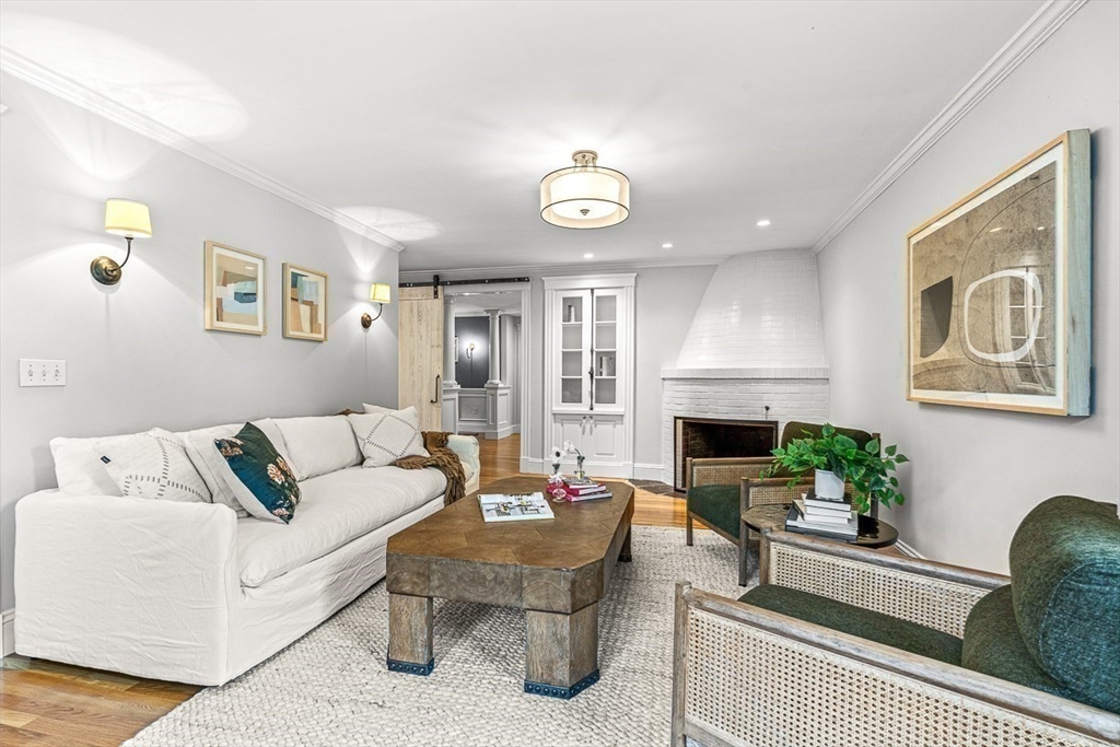 24 Birch Road Wellesley, MA 02482 - Photo 8 of 40 a living room with furniture fireplace and a large window