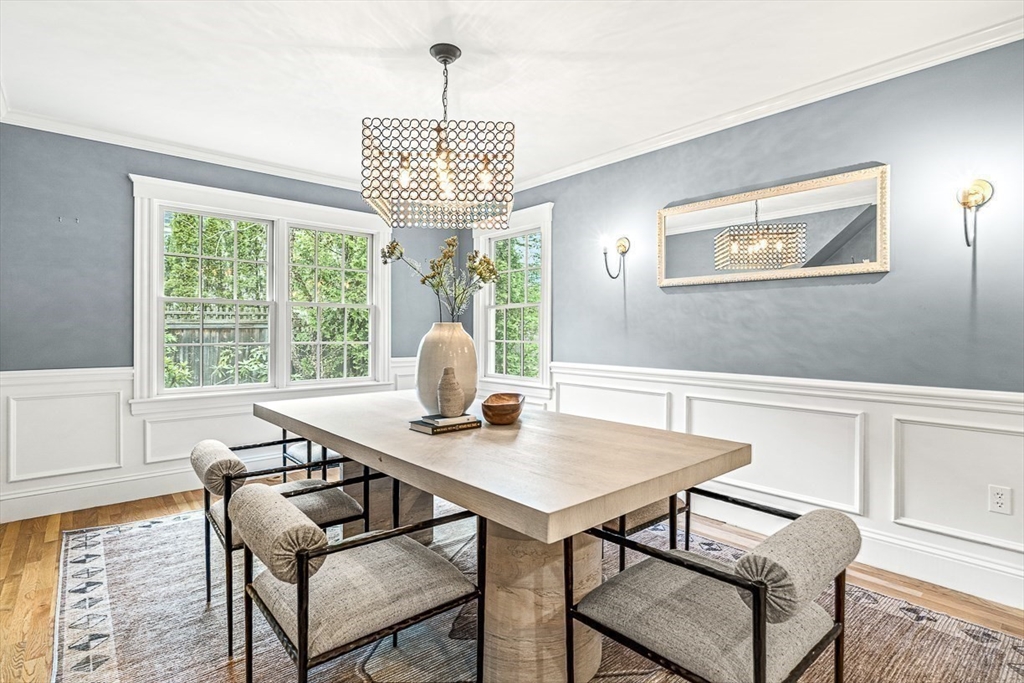 24 Birch Road Wellesley, MA 02482 - Photo 10 of 40 a view of a dining room with furniture a chandelier and wooden floor