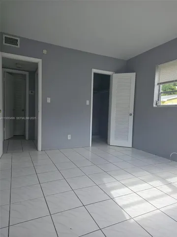 a view of an empty room and window