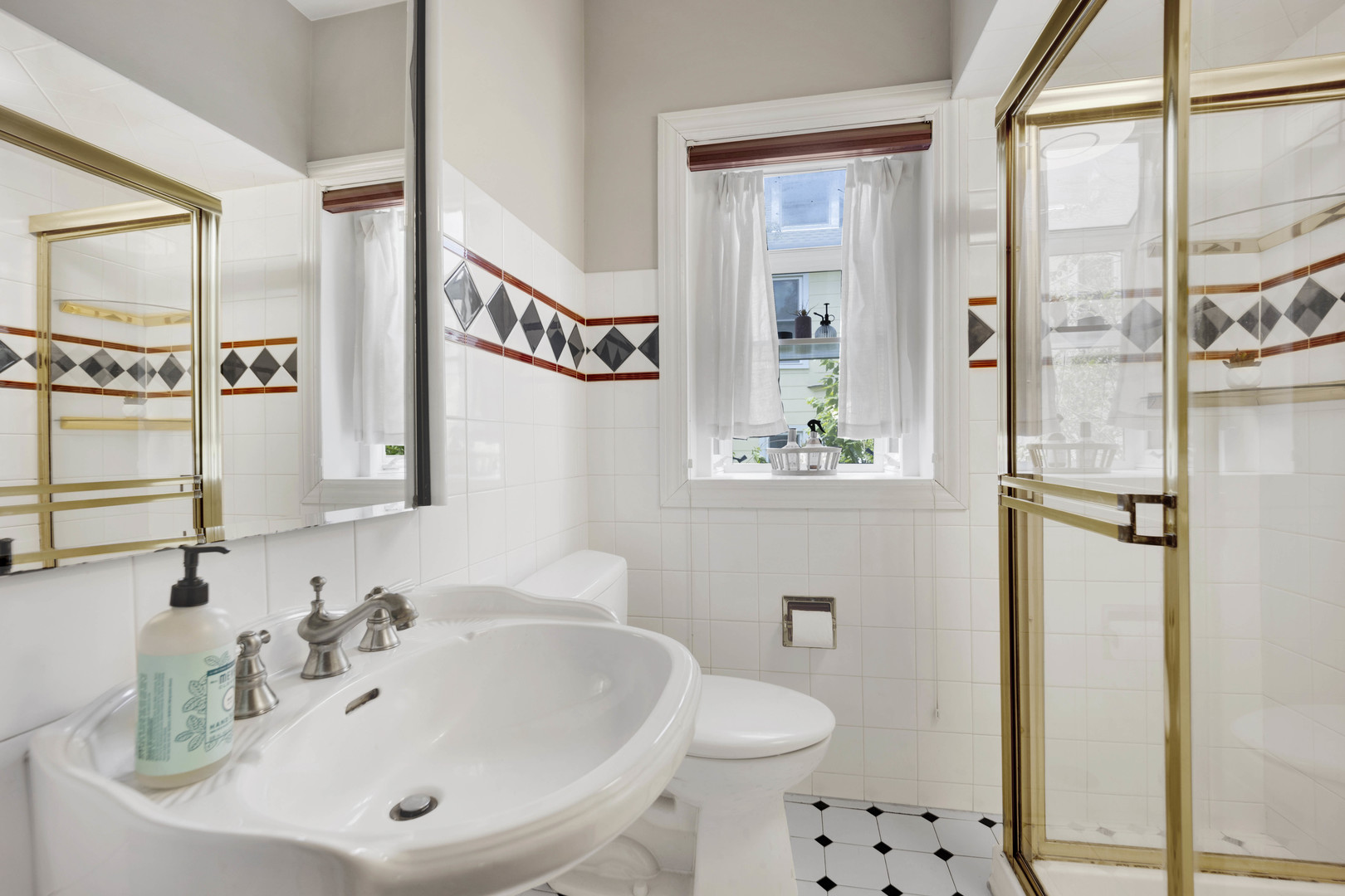 103 Pine Avenue Riverside, IL 60546 - Photo 16 of 42 a bathroom with a sink a toilet and shower