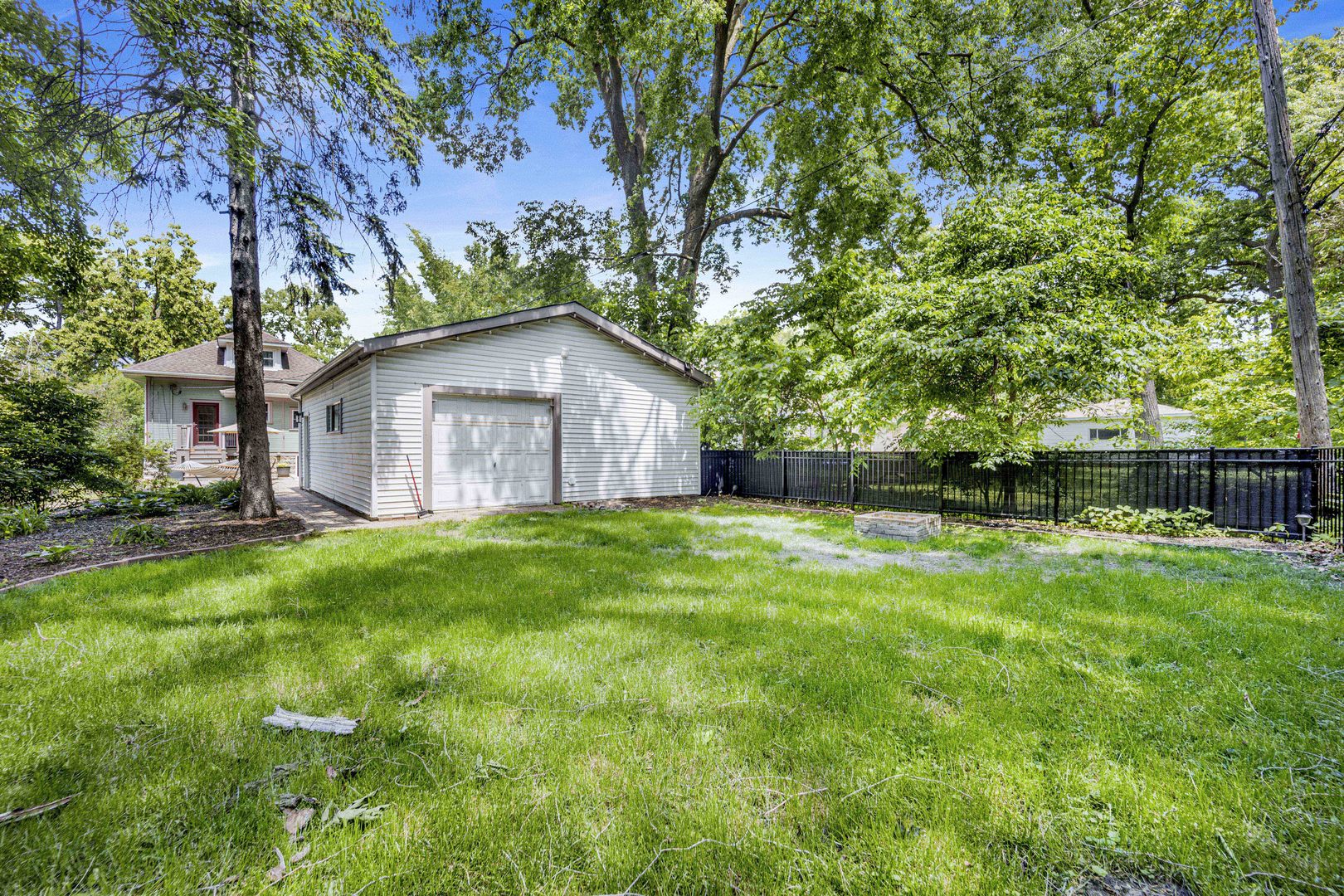 103 Pine Avenue Riverside, IL 60546 - Photo 31 of 42 a yellow house sitting in middle of the grass