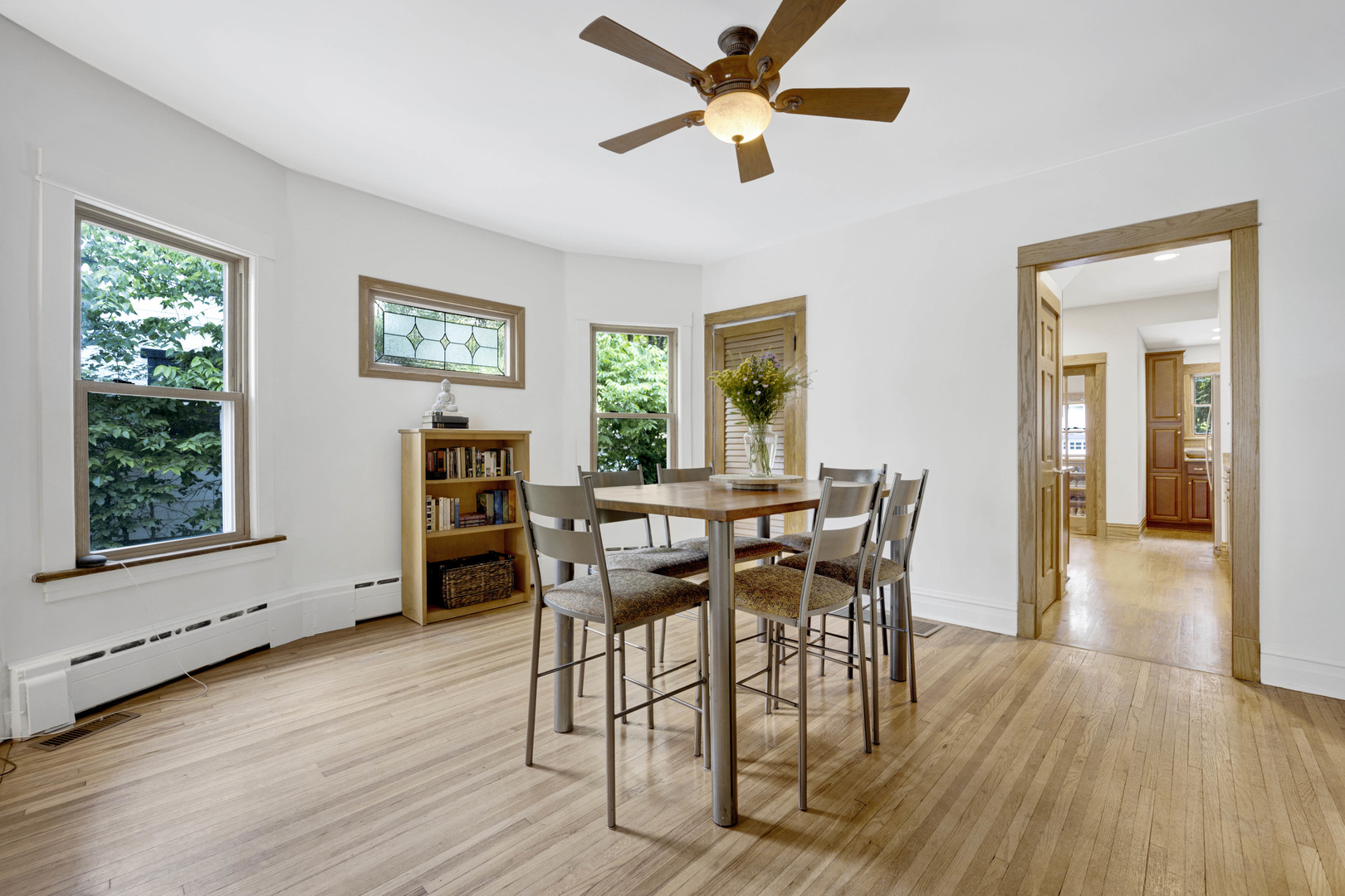 103 Pine Avenue Riverside, IL 60546 - Photo 8 of 42 a view of a dining room with furniture and wooden floor