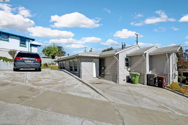 a view of a car park in front of house
