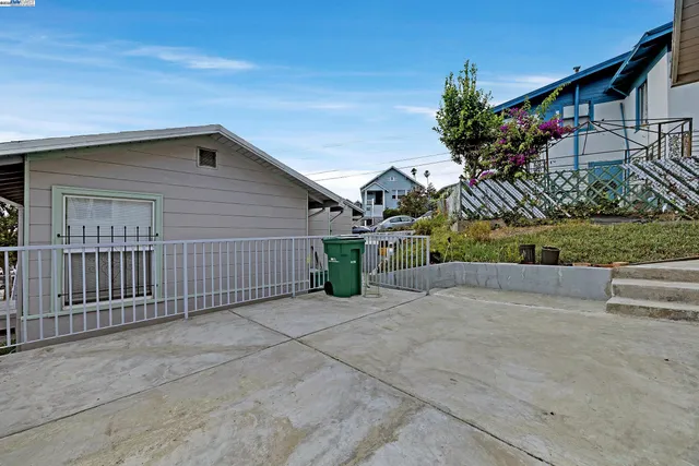 a view of a house with a small yard and plants