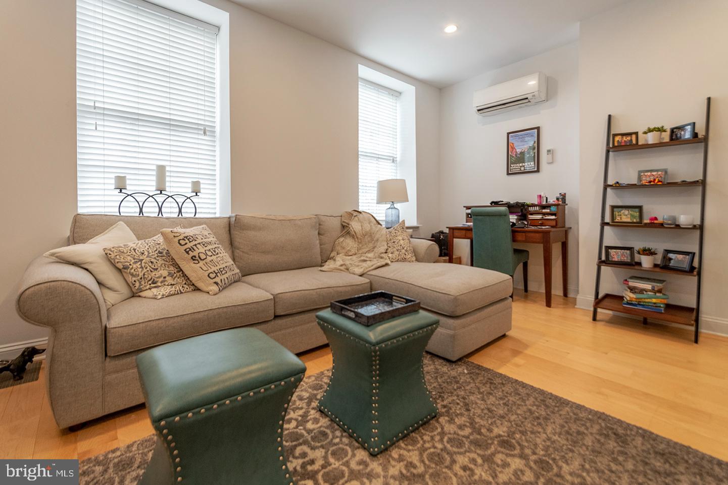 1311 Spruce Street, Unit 301 Philadelphia, PA 19107 - Photo 4 of 7 a living room with furniture and a window