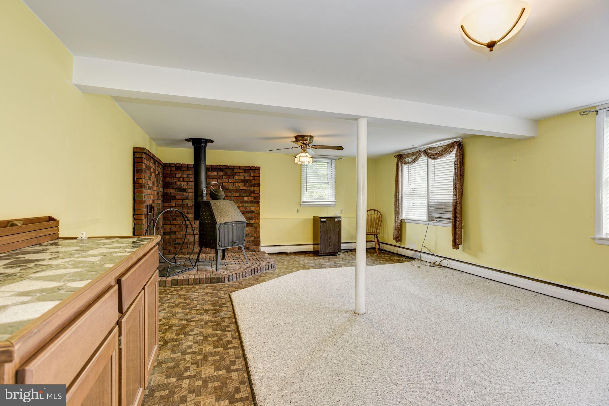 232 Rollingbrook Way Baltimore, MD 21228 - Photo 17 of 26 Family Room | Wood Stove