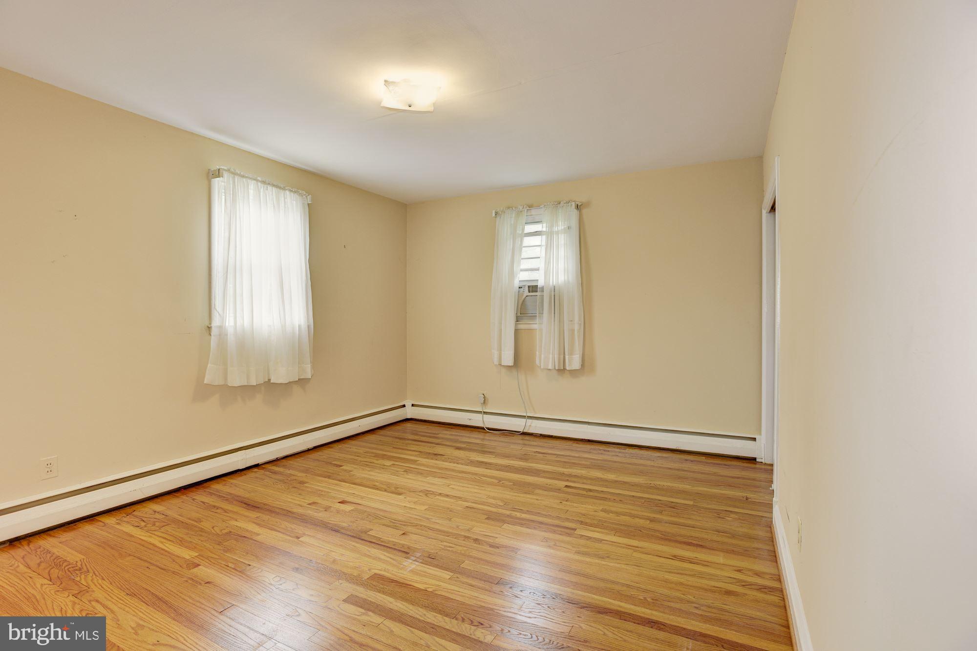 232 Rollingbrook Way Baltimore, MD 21228 - Photo 9 of 26 Primary Bedroom | Hardwood Floors
