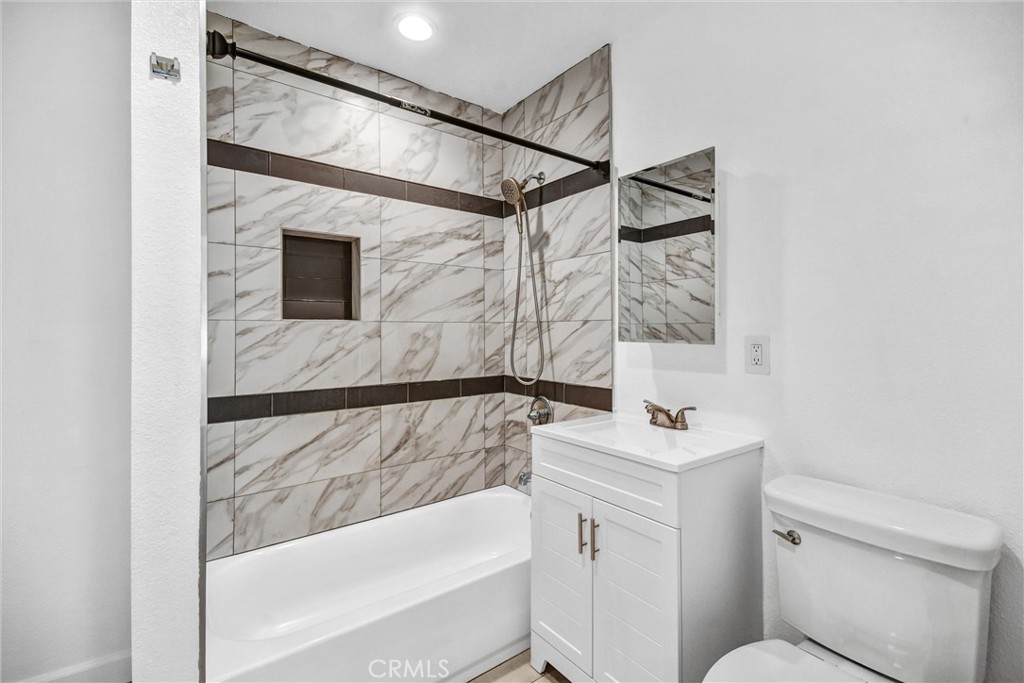 3913 Walnut Street Baldwin Park, CA 91706 - Photo 17 of 25 a bathroom with a sink and a bathtub