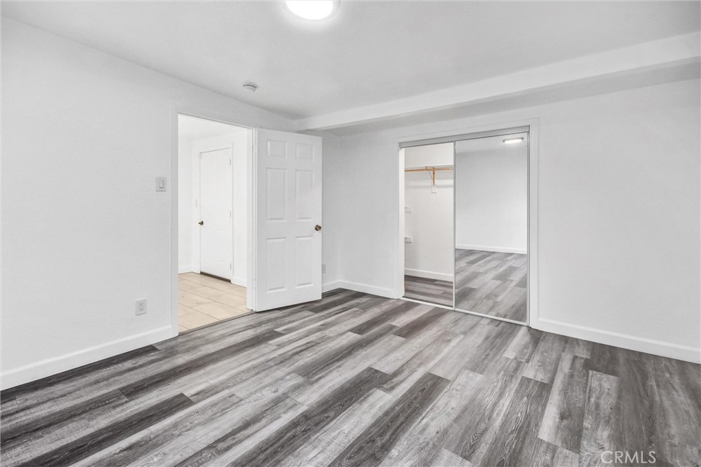 3913 Walnut Street Baldwin Park, CA 91706 - Photo 19 of 25 a view of empty room with wooden floor