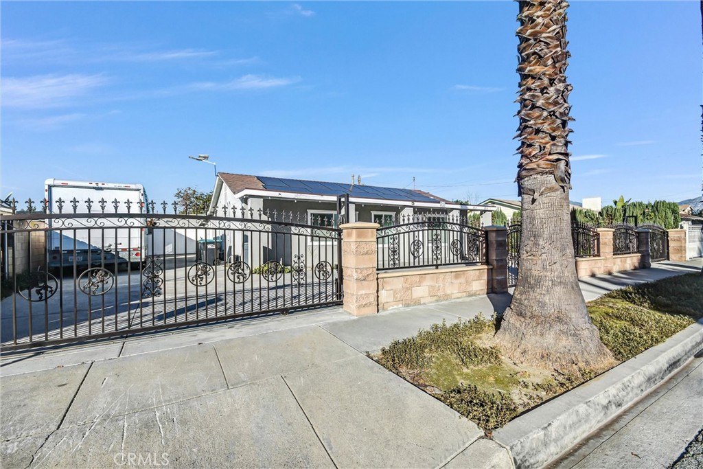 3913 Walnut Street Baldwin Park, CA 91706 - Photo 2 of 25 a view of a balcony with floor to ceiling windows