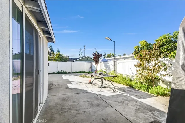 a view of a backyard with sitting area