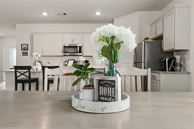 a view of kitchen with stainless steel appliances granite countertop counter space a sink dishwasher and cabinets with wooden floor